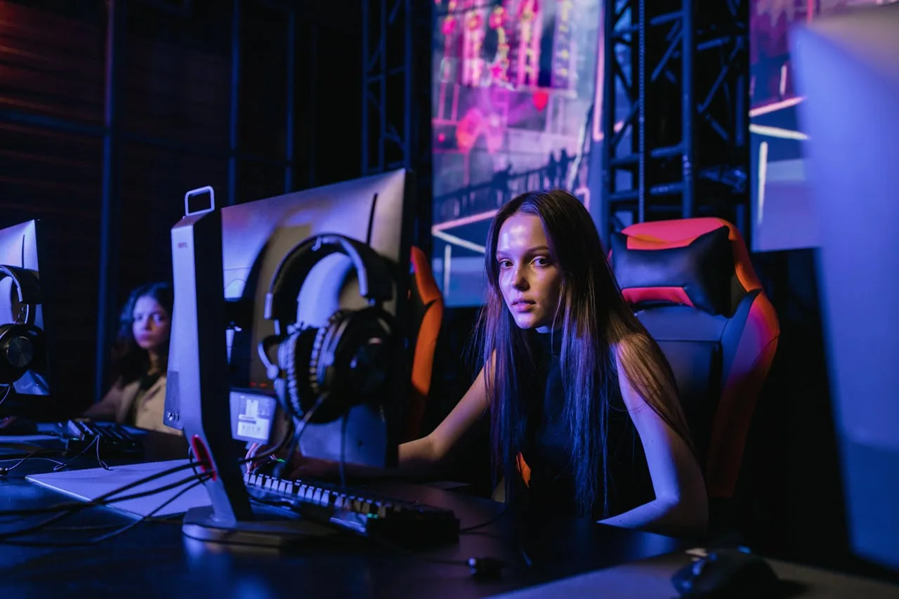 Professional esports player reviewing crosshair settings at a tournament setup