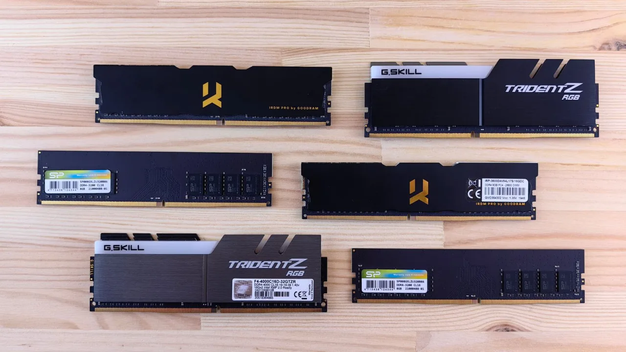 Several DDR4 memory modules from different brands laid out on a wooden table